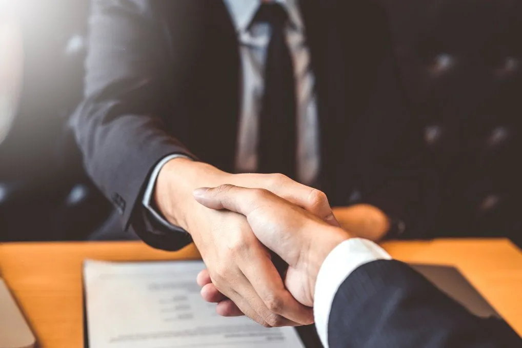 Manager reviewing a resume in an interview